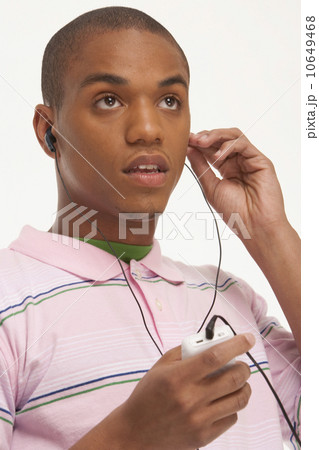 Enjoying the Beat. a Smiling Ethnic Woman Enjoying Her Headphones