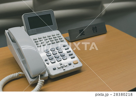 オフィス 受付 内線電話 会社の写真素材