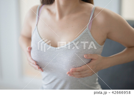 Womans body topless, cover breasts with hands, - Stock Photo [84486387]  - PIXTA