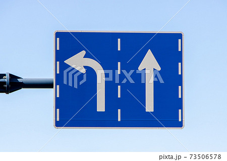 左折 標識 直進 道路の写真素材