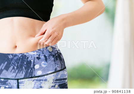 slim athletic woman torso abs belly wearing sportswear. slimming