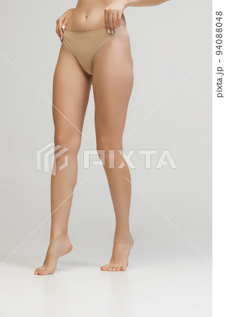 Naked women in panties hugging on beach - Stock Photo [78538807] - PIXTA