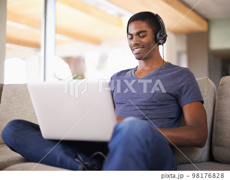 Enjoying the Beat. a Smiling Ethnic Woman Enjoying Her Headphones